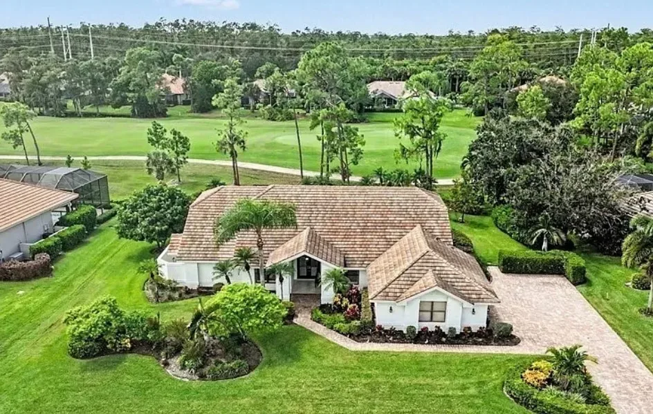 Elevated aerial view of 20248 Puma Trail with the Wildcat Run golf course in the background