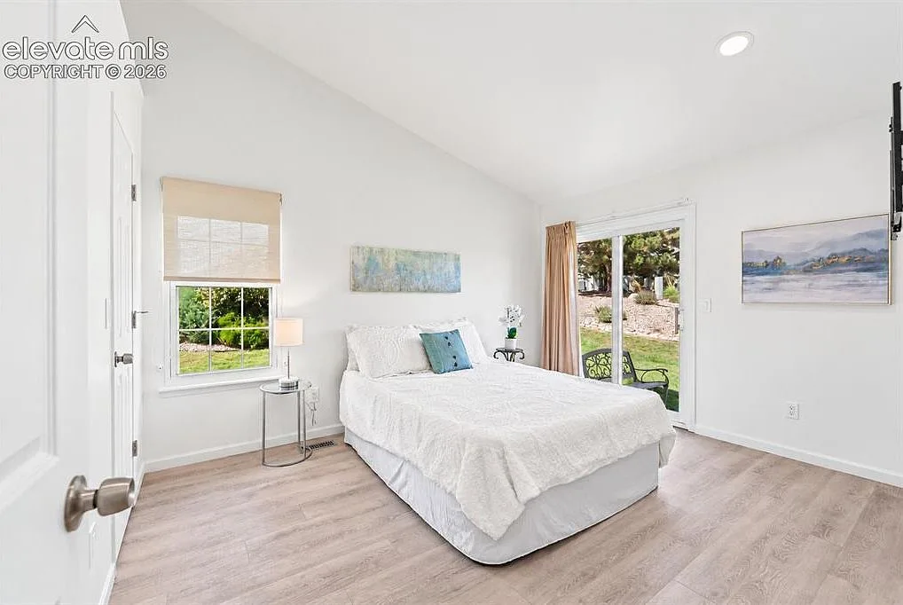Primary bedroom with sliding door to a private patio