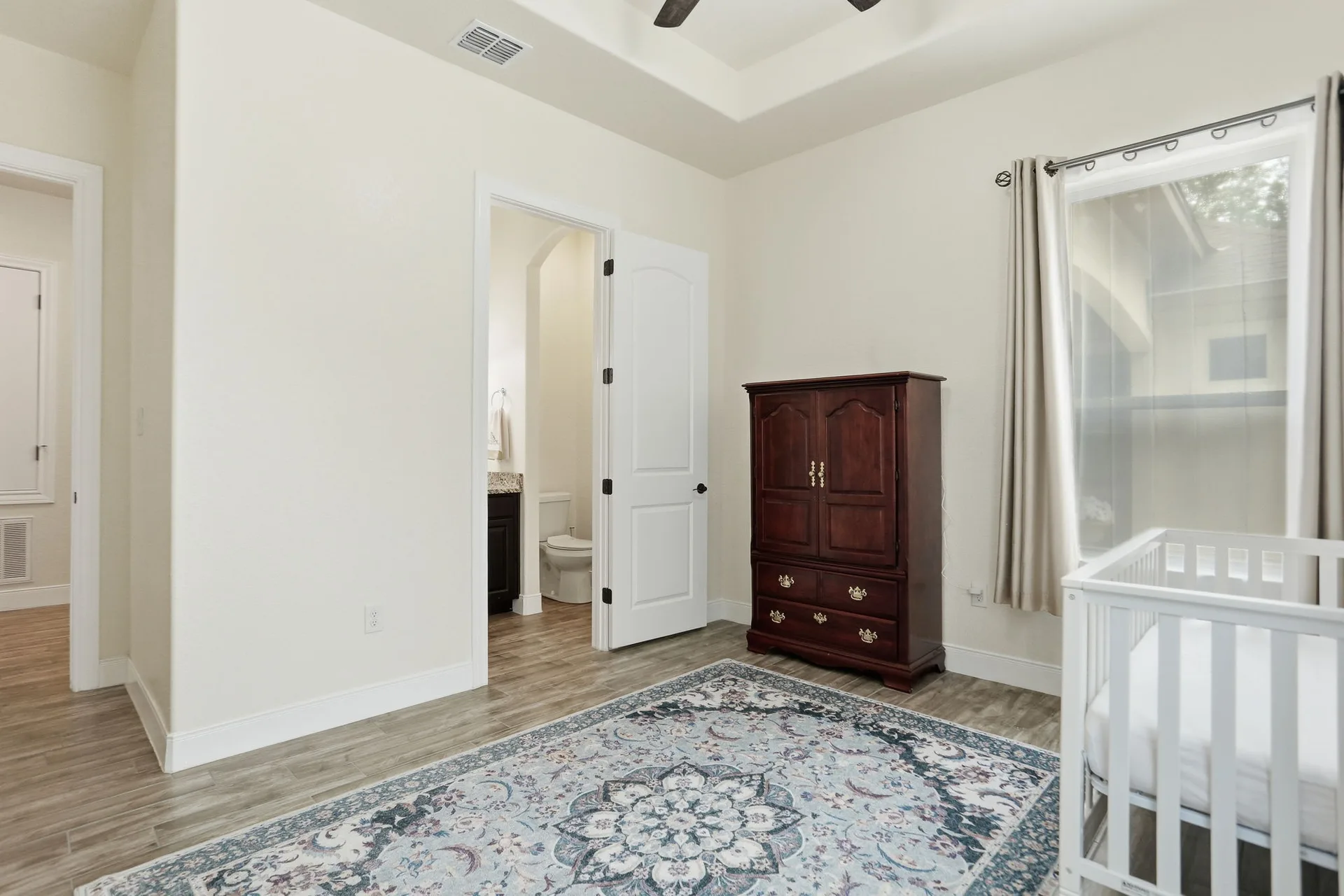Secondary bedroom with tray ceiling