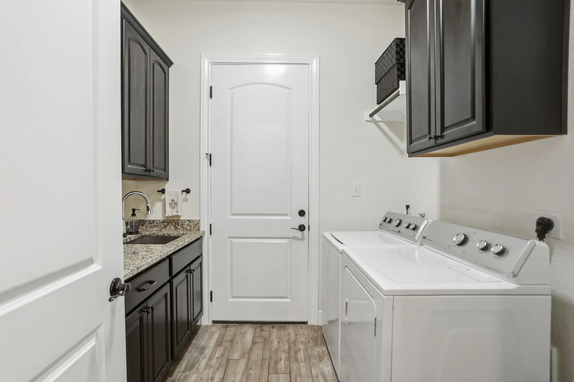 Utility room with built-in cabinetry