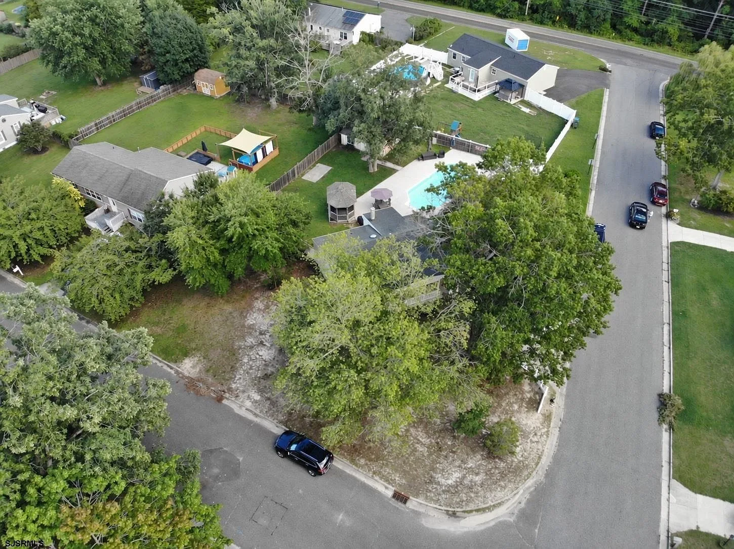 Aerial view of the corner lot and surrounding neighborhood