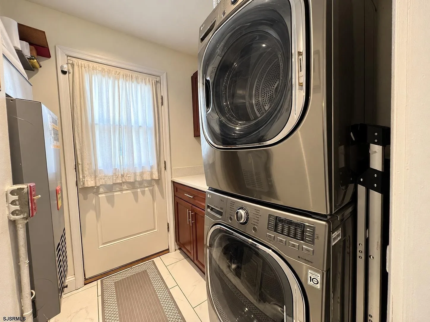 Laundry nook with stacked washer and dryer
