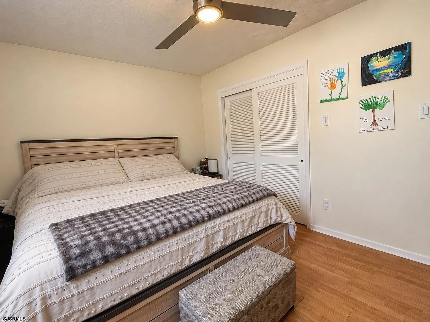 Primary bedroom with white closet doors