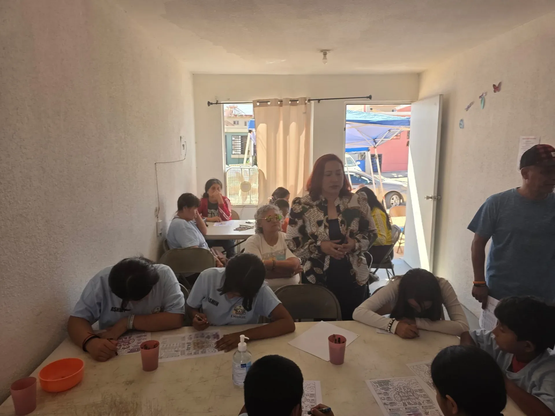 Craft tables and supplies in the kids ministry activity room in Ensenada