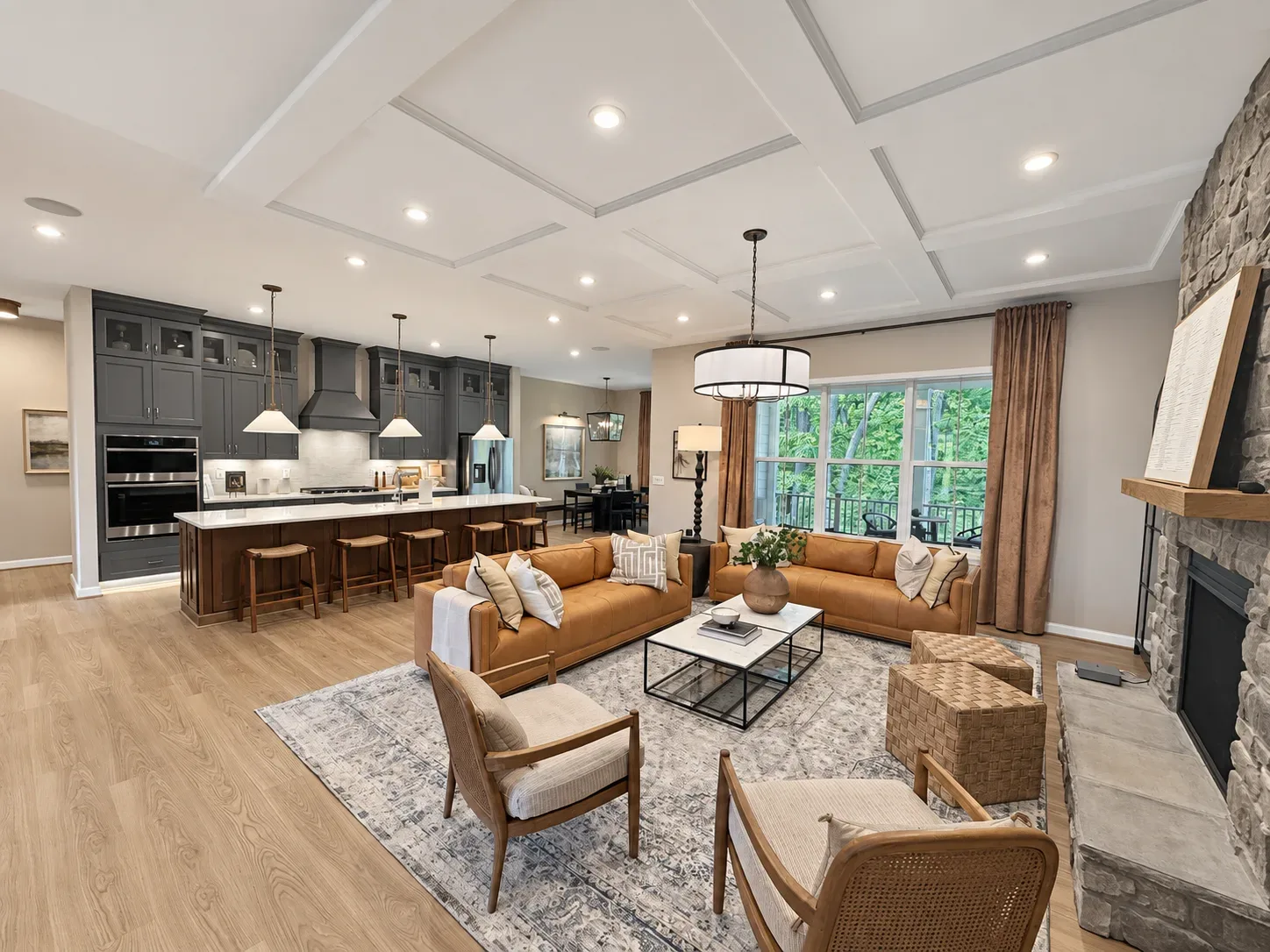 Open-concept kitchen flowing into the living area of a new construction home
