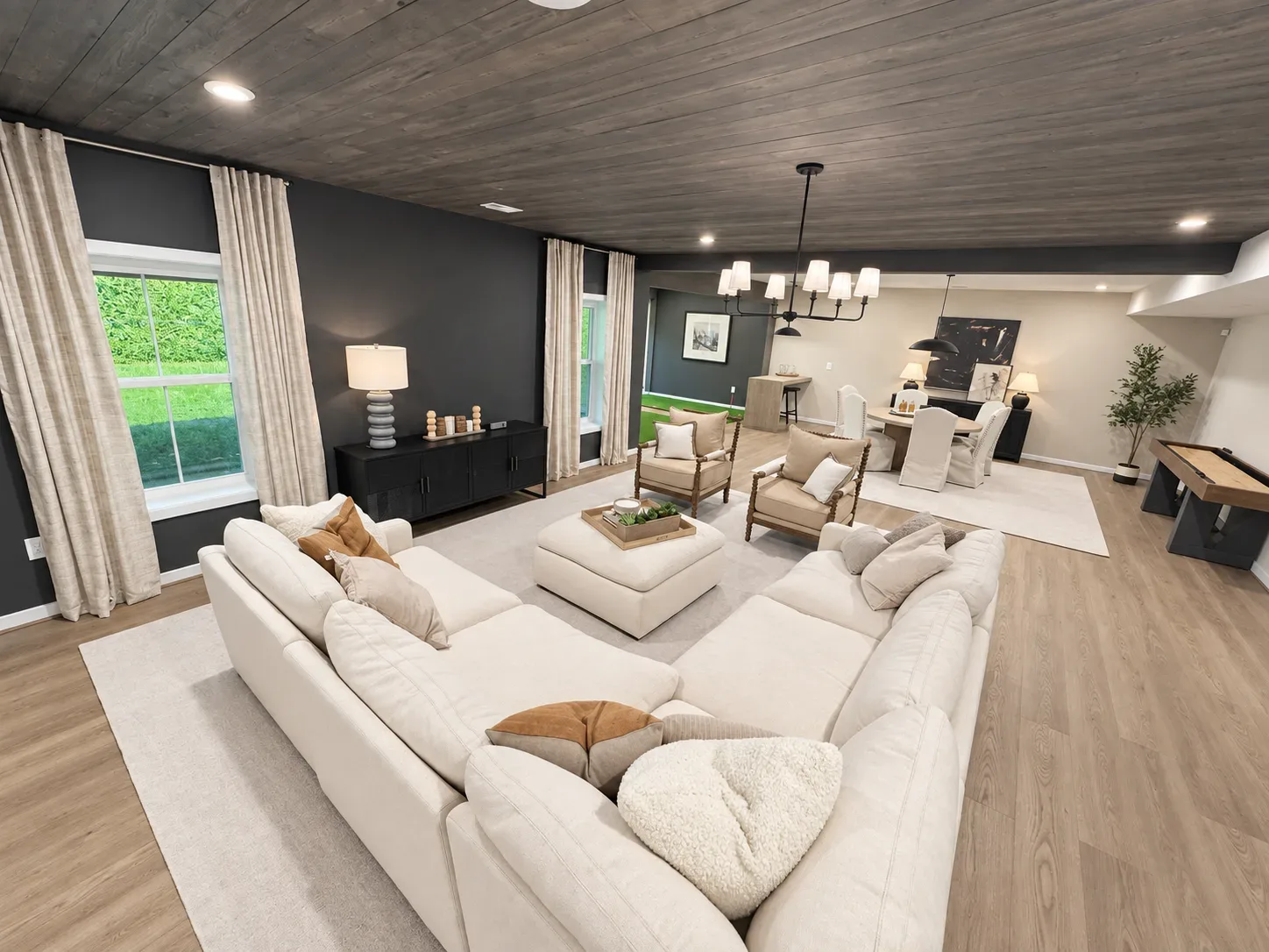 Spacious living and dining area in a new construction home with natural light