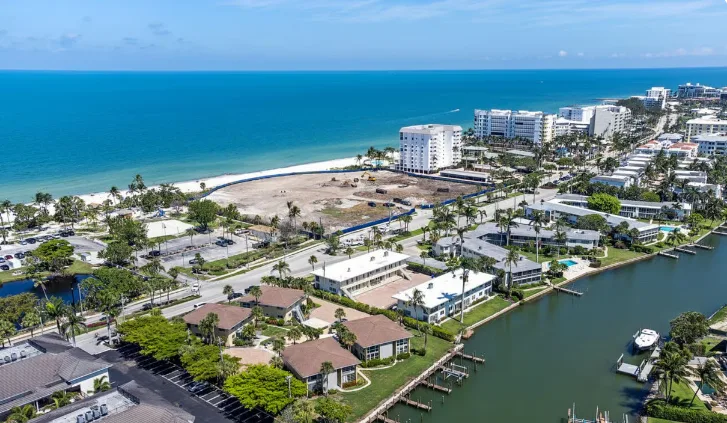 Aerial view of the Port Royal coastline with beachfront homes and canal boat slips