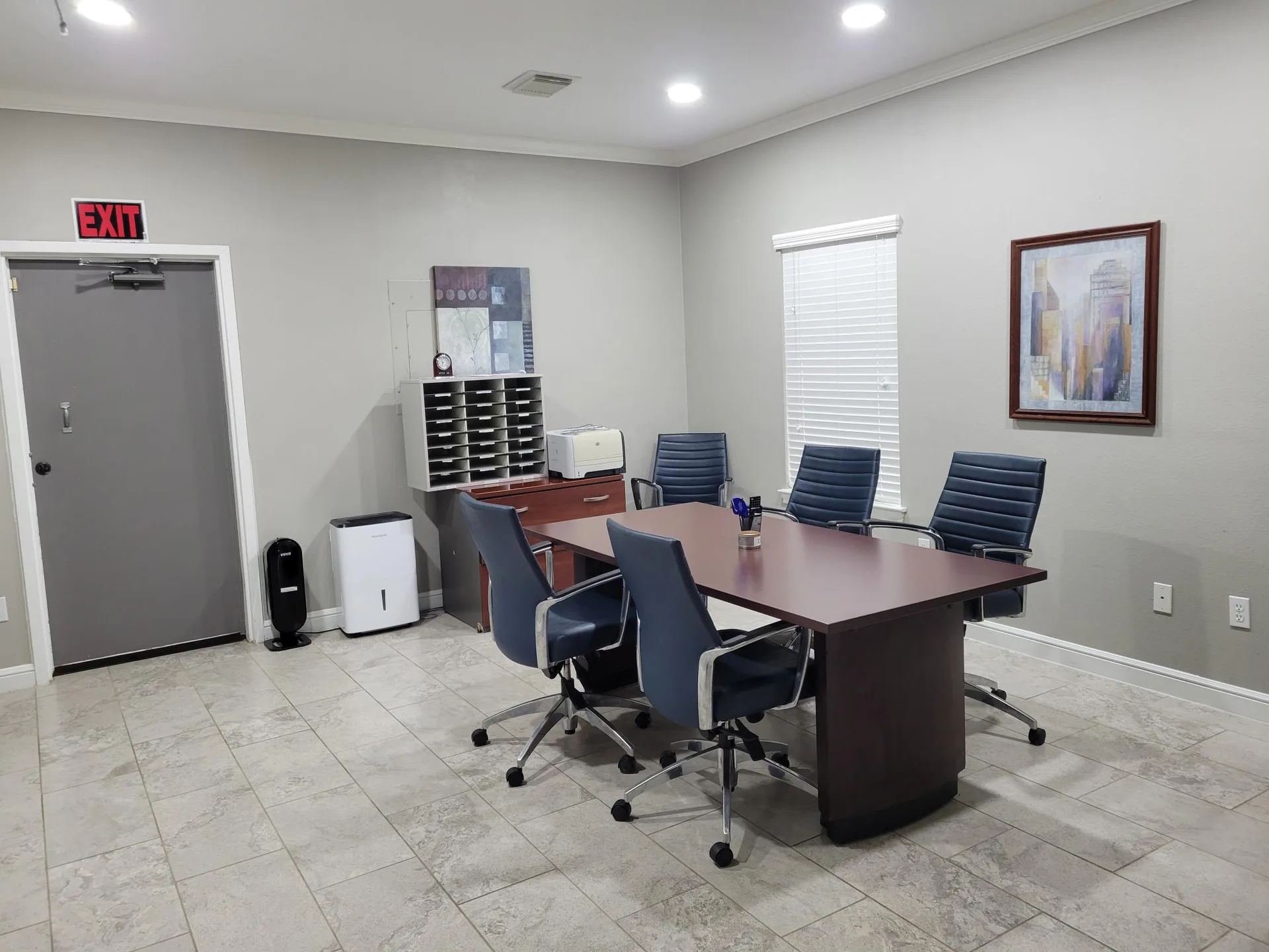 Conference room with a table, office chairs, and recessed lighting at Provincial Professional Plaza