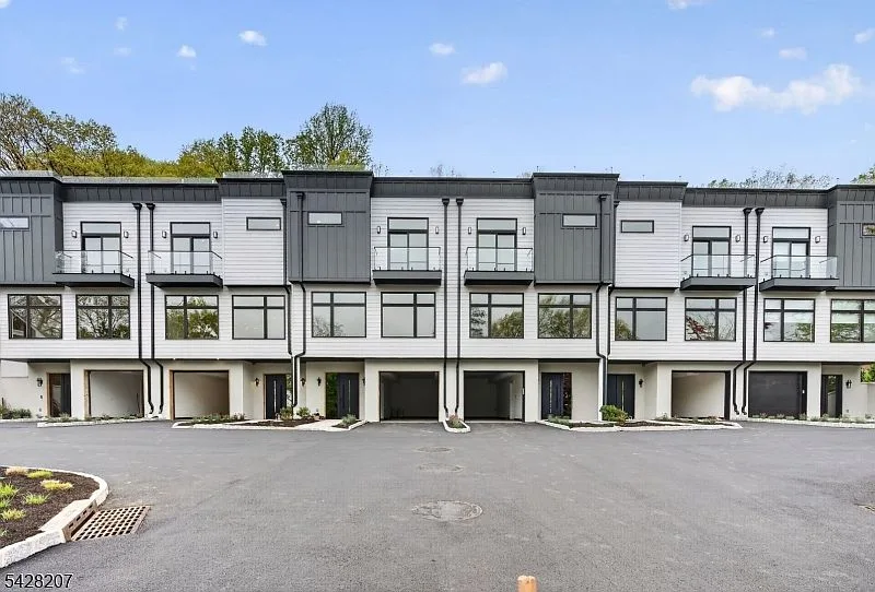 Exterior facade of modern luxury townhouses at 522 Valley Rd in Clifton, NJ