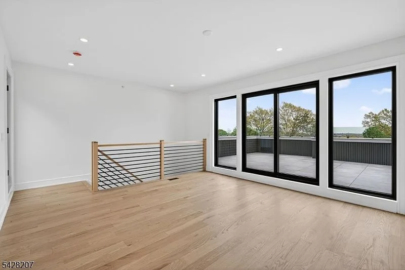 Top-floor flex space leading out to the rooftop terrace
