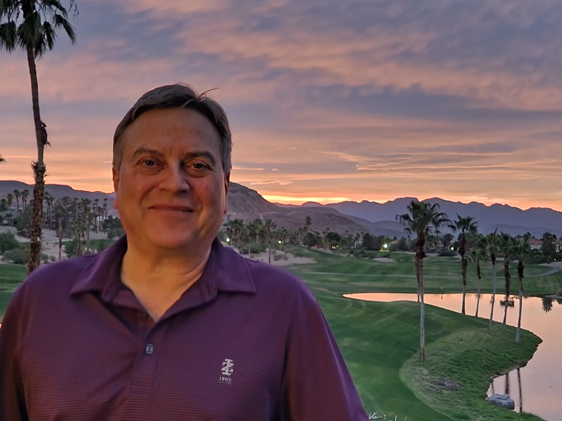 Martin's photo of the Rhodes Ranch golf course at sunset with the pond, palm trees, and mountains glowing in the distance