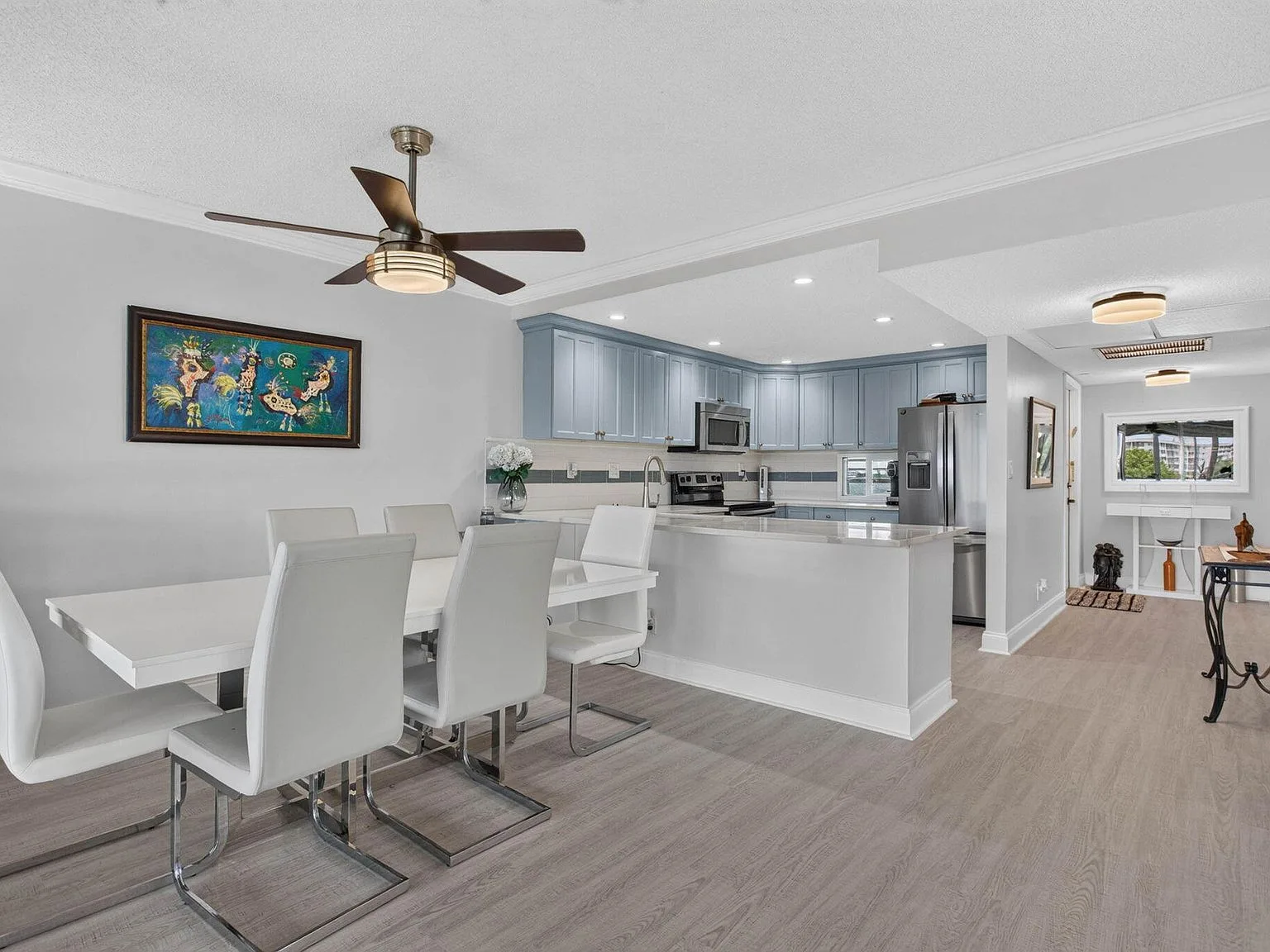 Dining + Kitchen, Flow for entertaining at 2901 S Palm Aire Drive #610