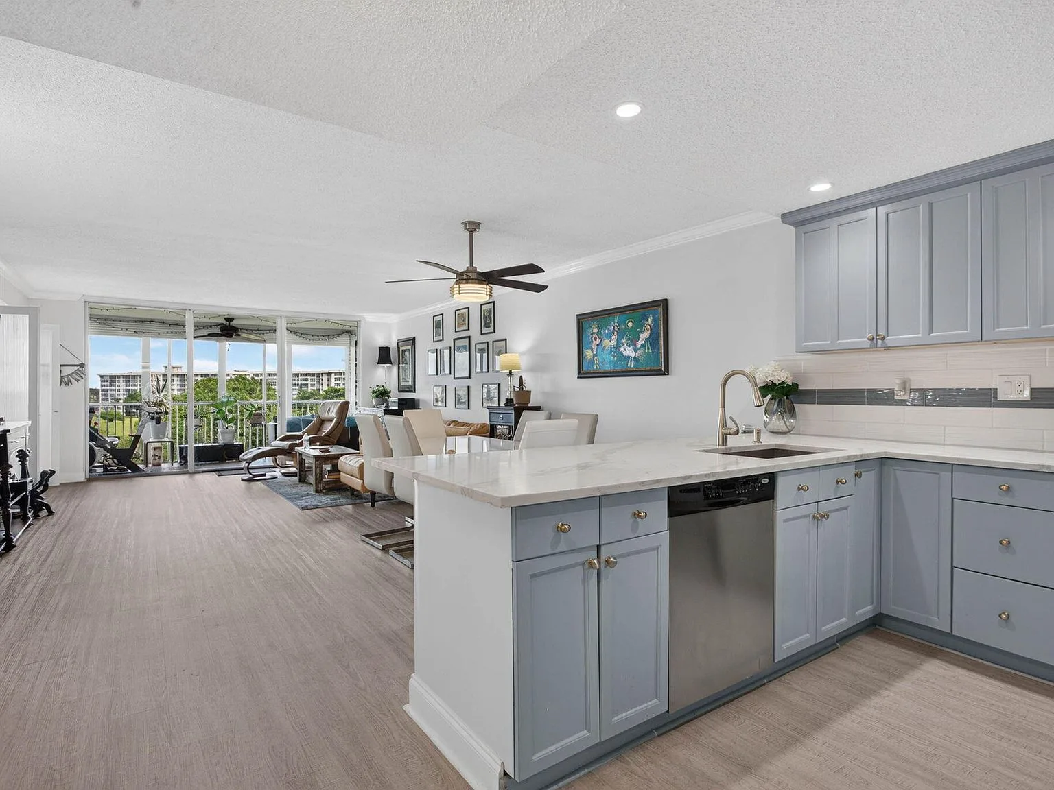 Kitchen + Living, Custom-painted cabinets at 2901 S Palm Aire Drive #610