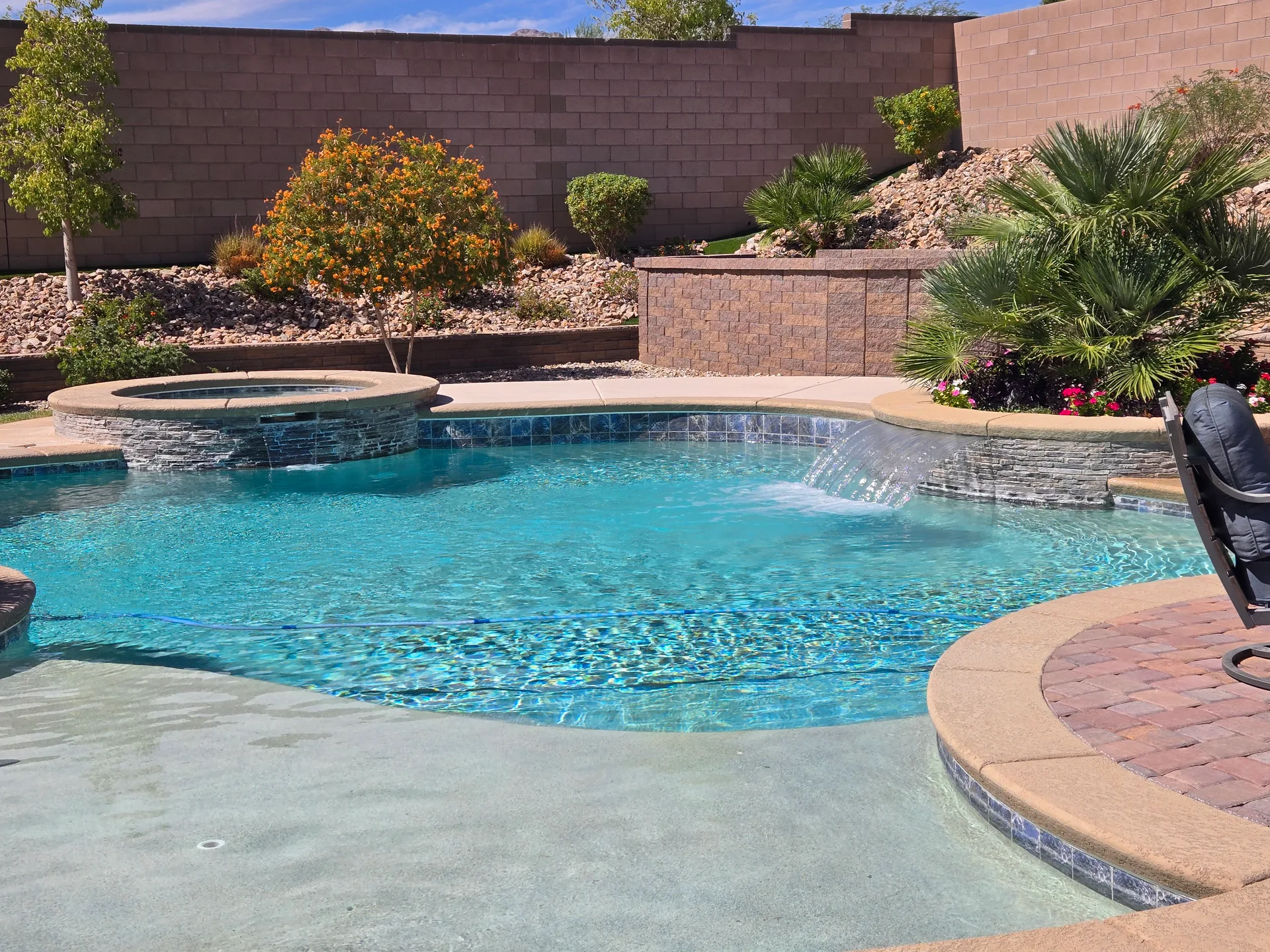 Resort-style swimming pool and spa at 10380 Mystic Ledge Ct, a northwest Las Vegas estate near Summerlin