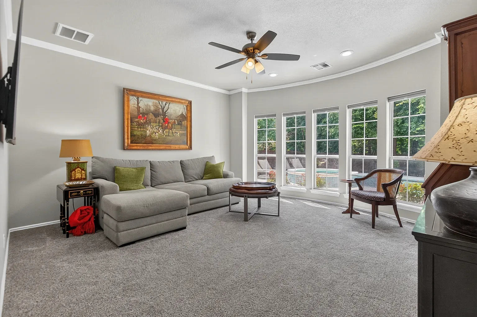 Great room with a curved wall of windows