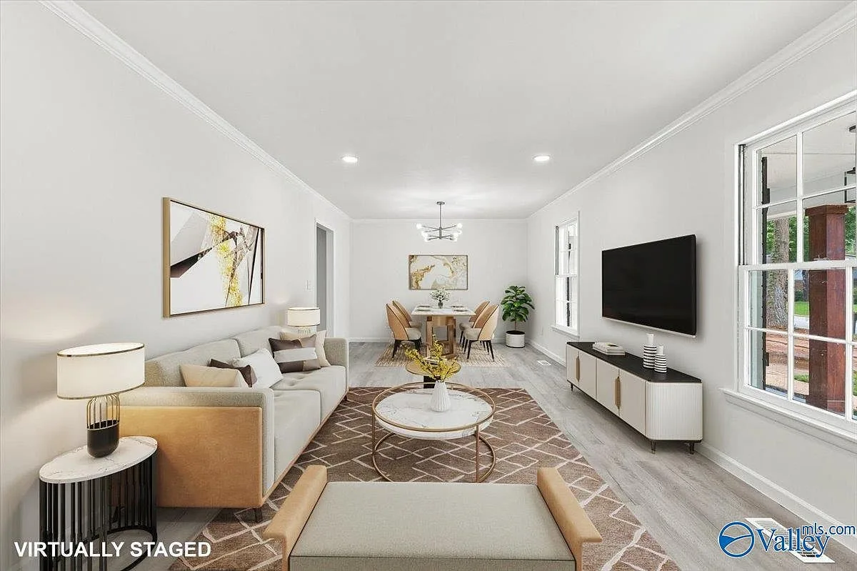 Combined living and dining room with wood-look flooring and bright natural light