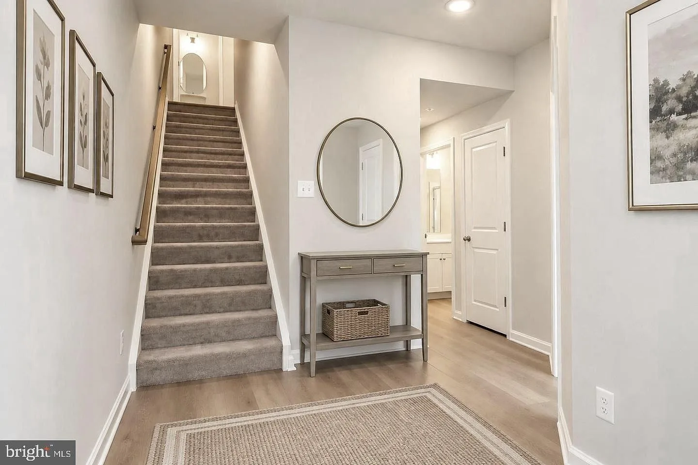 Entry foyer with stairs and generous closet space
