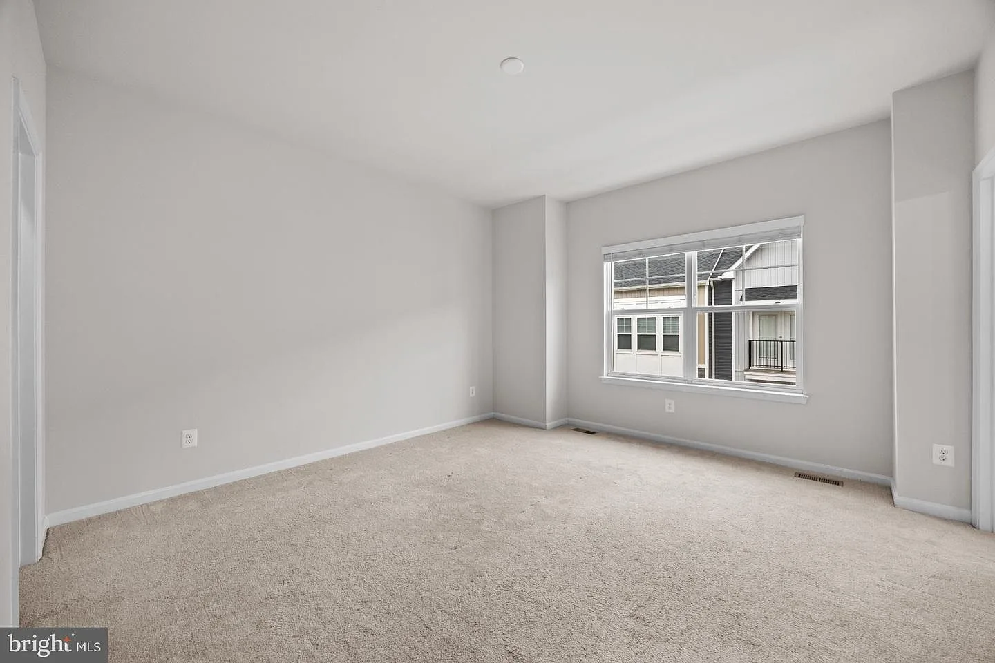 Bright bedroom with new blinds and neutral carpet