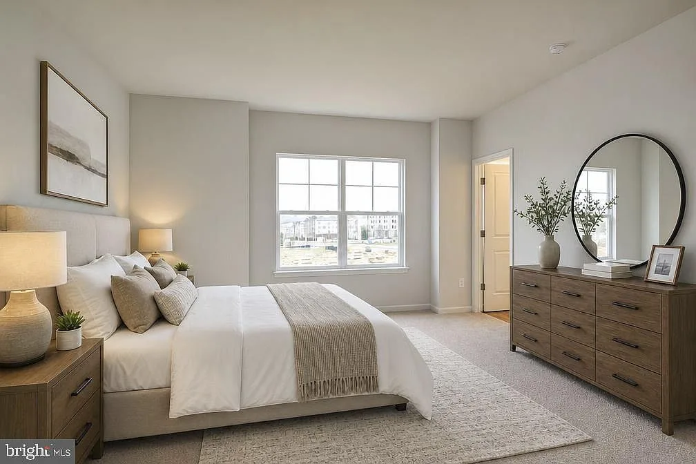 Primary suite, alternate view with dresser and mirror