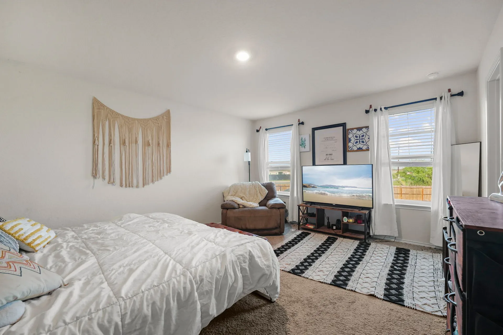 Bedroom with two windows and neutral walls, ready for your own layout