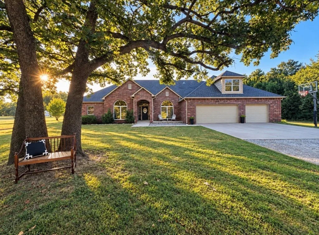Brick ranch home on acreage at sunset at 5607 S 281st East Avenue, Broken Arrow, OK