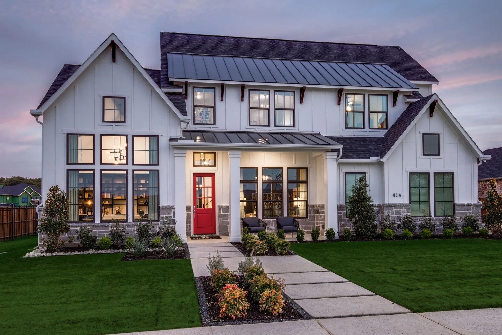 Modern farmhouse new construction at dusk