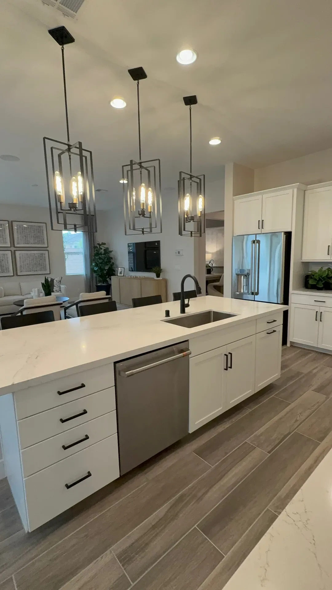 Bright modern Las Vegas kitchen with a white quartz waterfall island