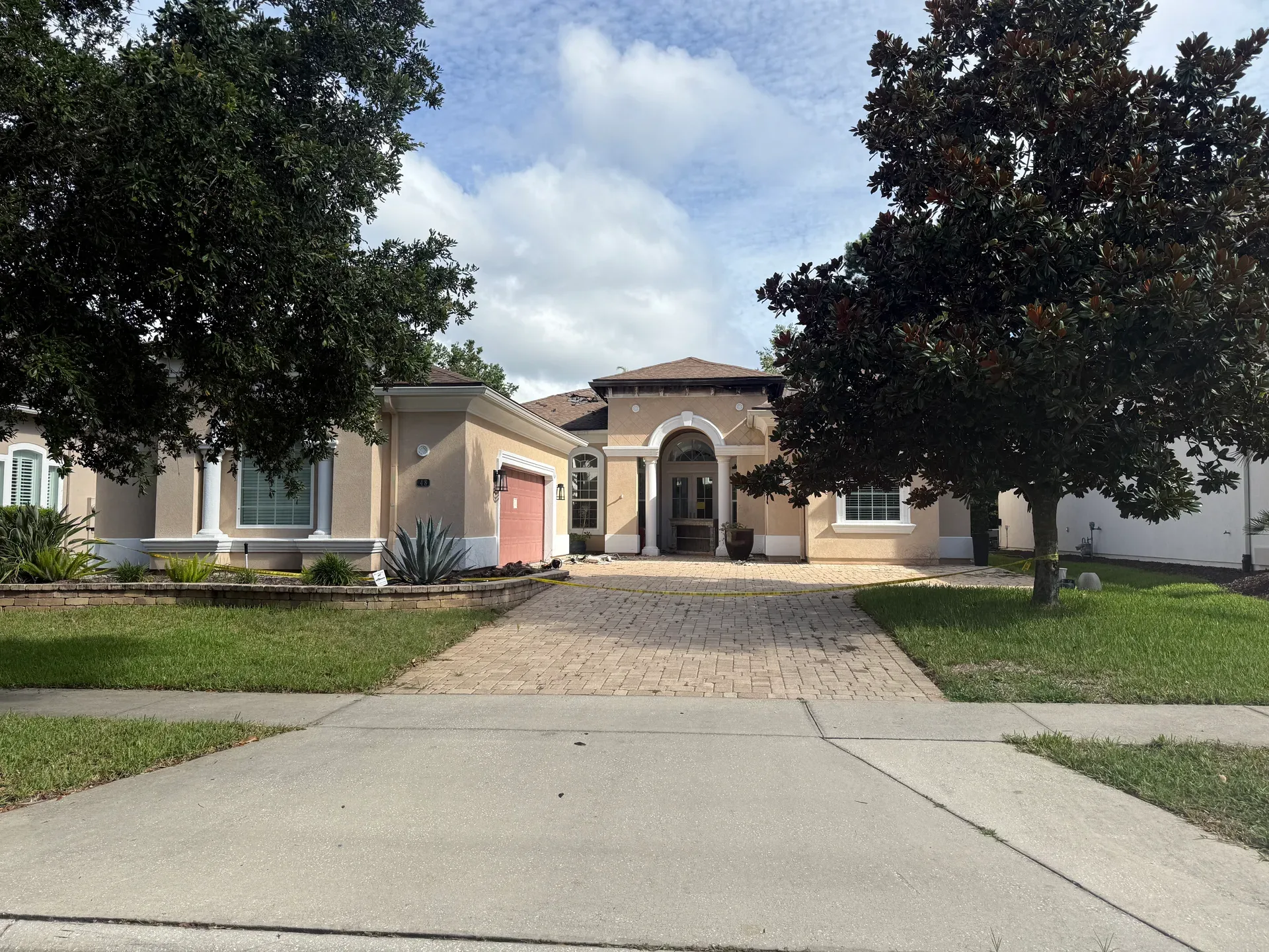 The original home on the lot at 48 Marco Island Way in Coastal Oaks