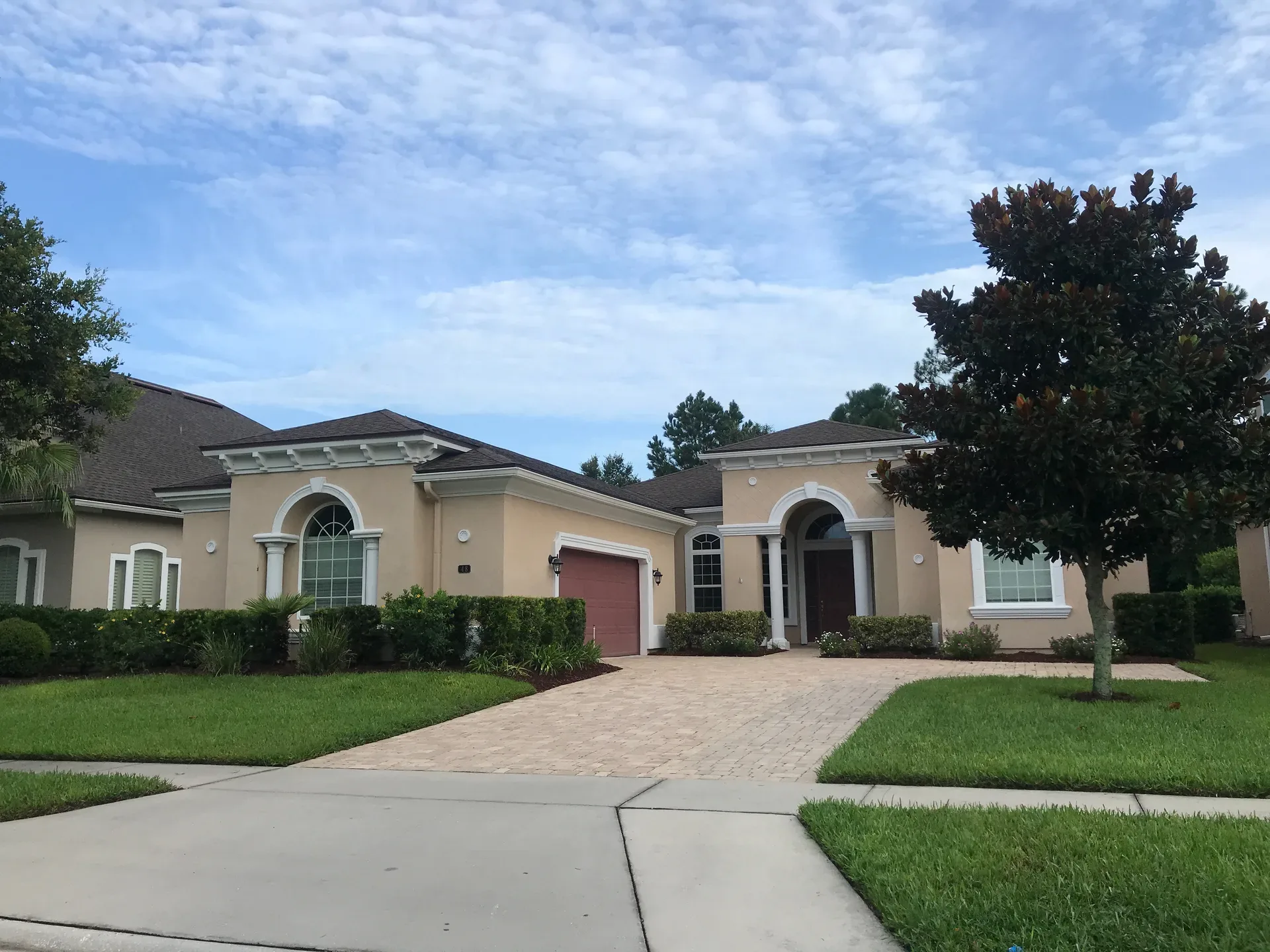 The original residence at 48 Marco Island Way in Coastal Oaks