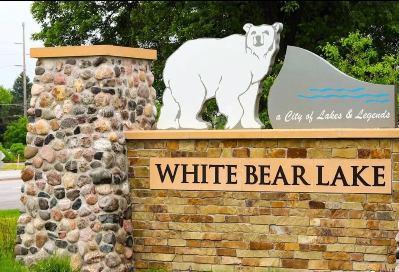 White Bear Lake welcome sign with a stylized white bear monument