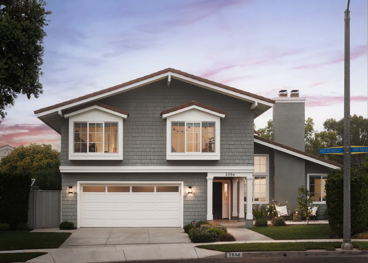 Exterior facade of a gray home at 2056 Port Weybridge Place, Newport Beach, CA