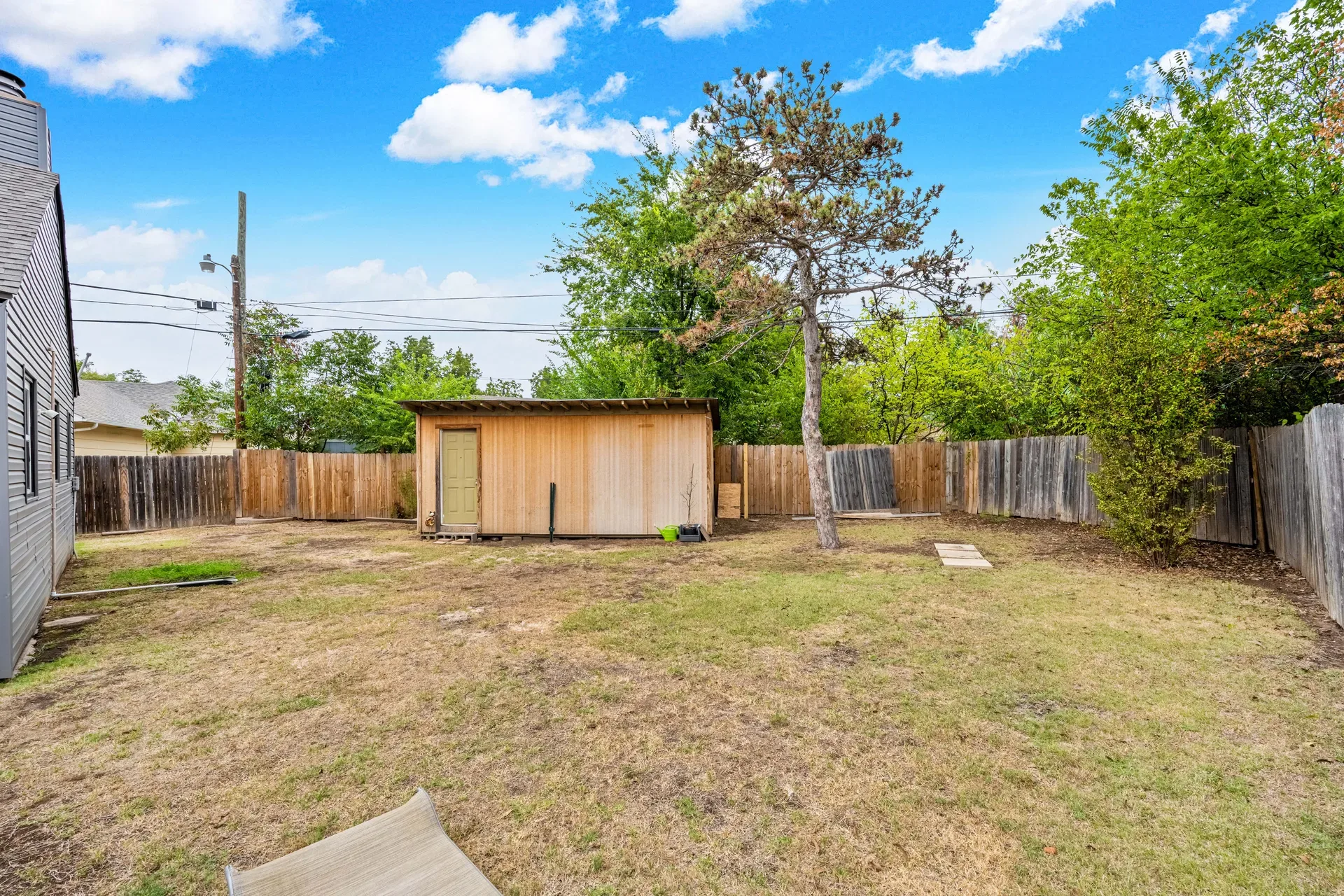 Workshop-style shed behind the home