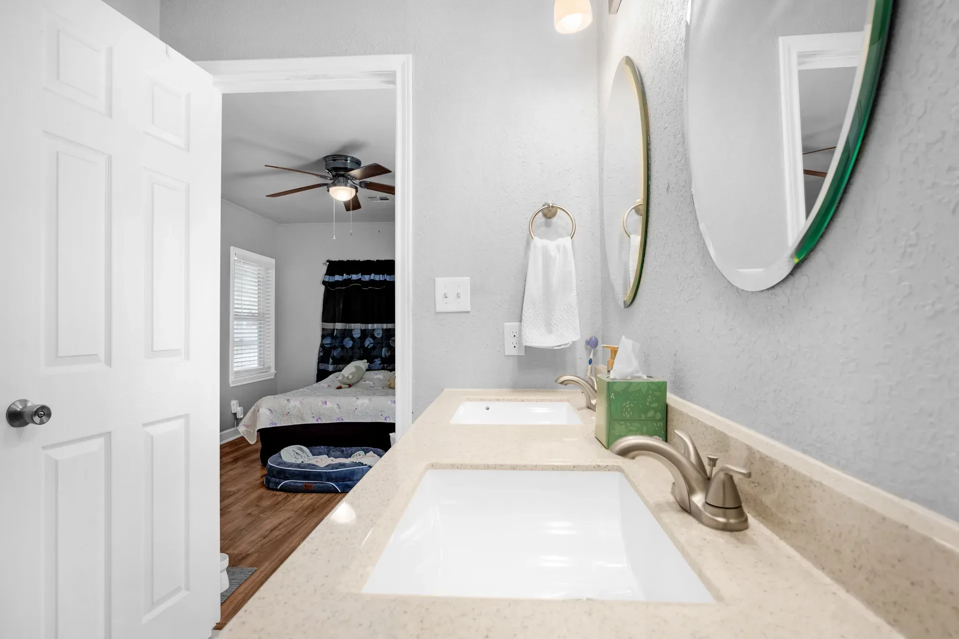 Bathroom vanity seen from the bedroom doorway