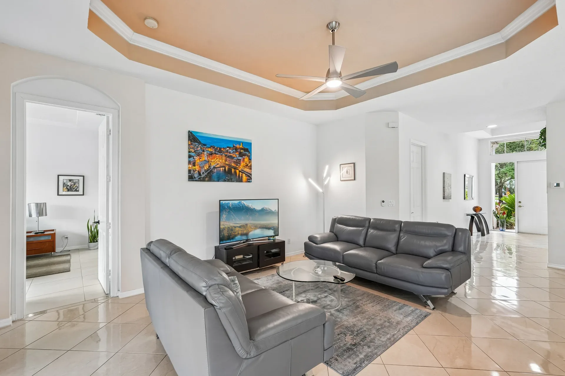 Living room at 309 Harvard LN with tray ceiling and natural light