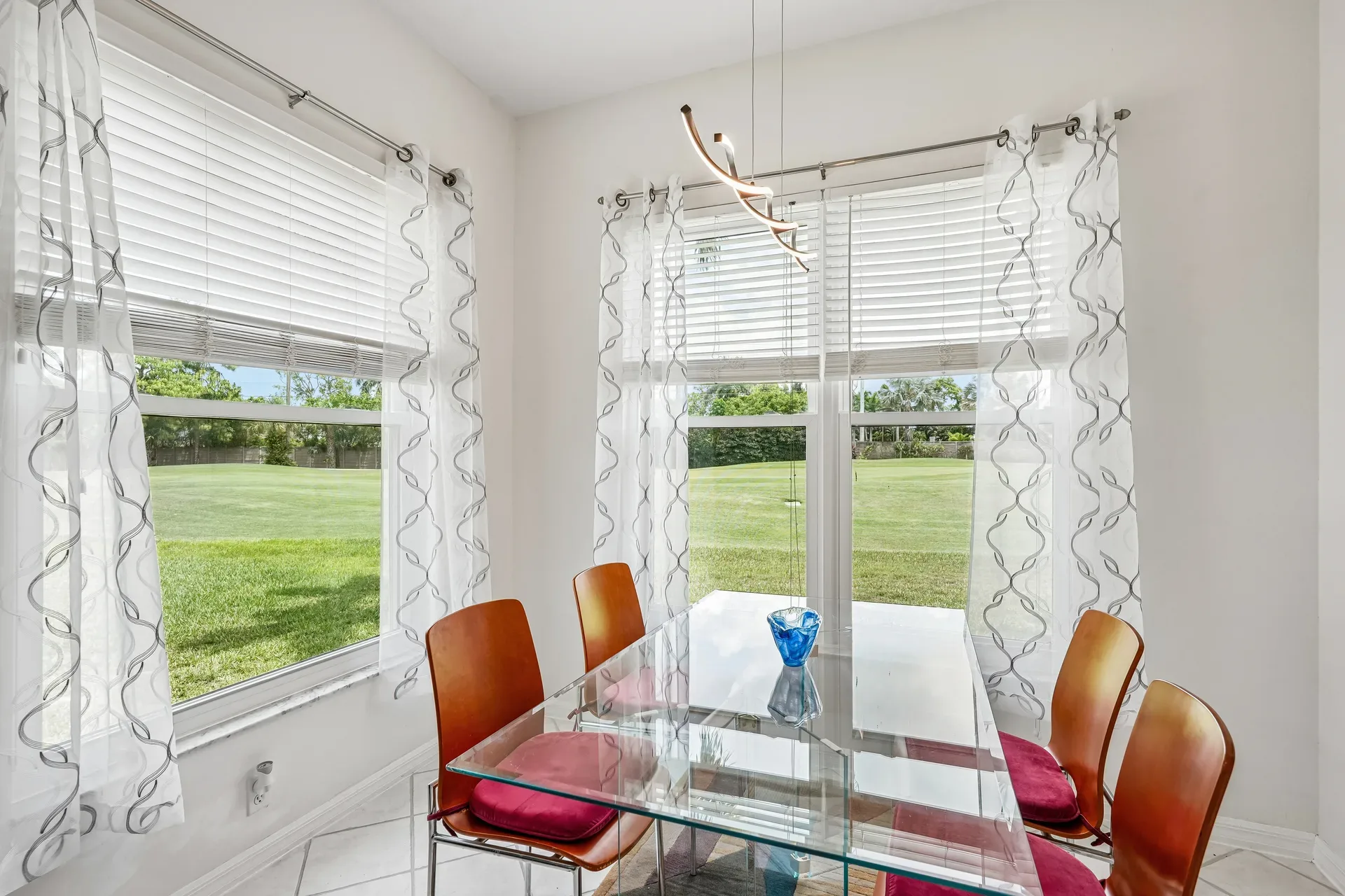 Dining area with golf course views through large windows