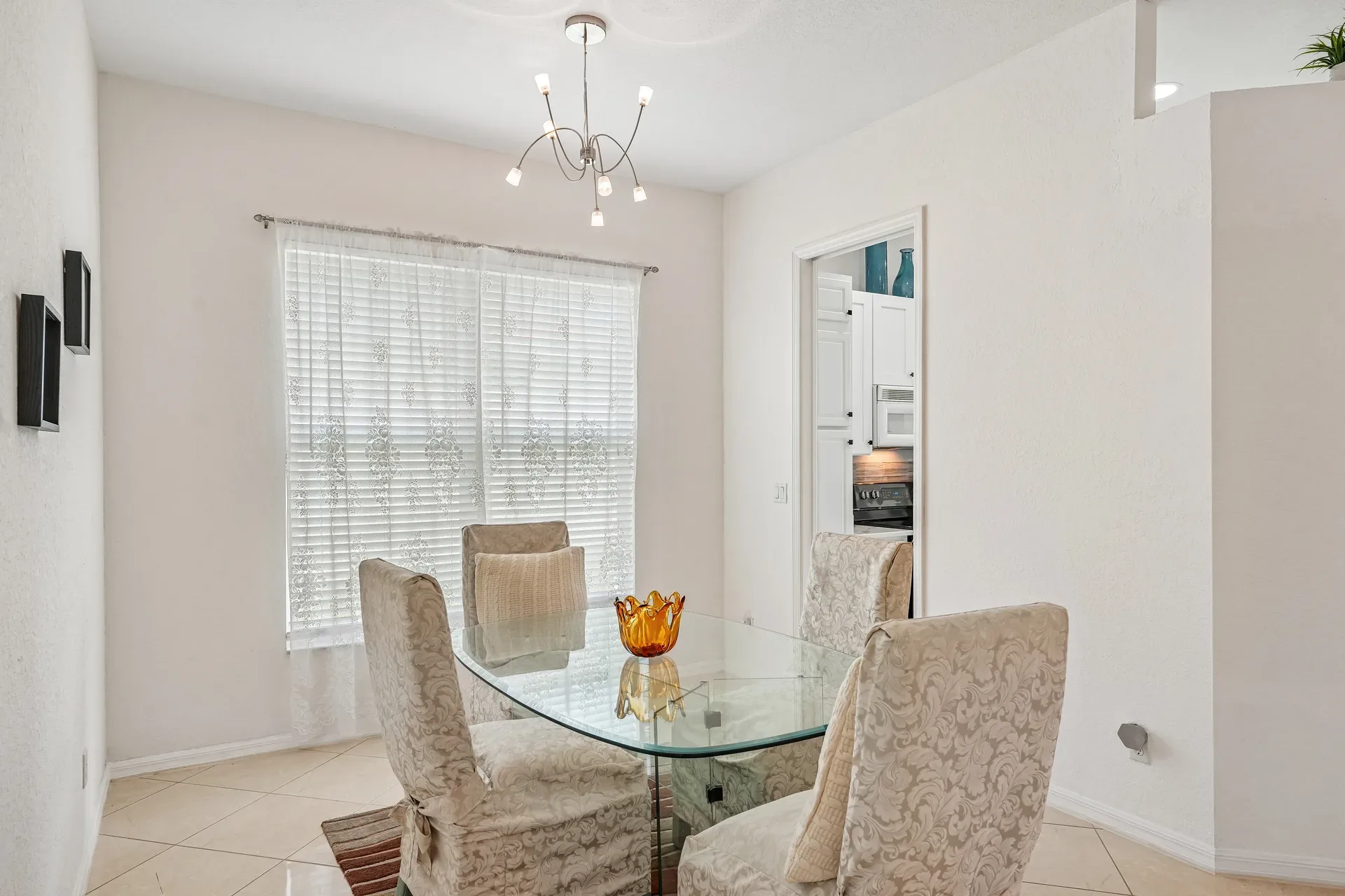 Dining room with large window and bright natural lighting