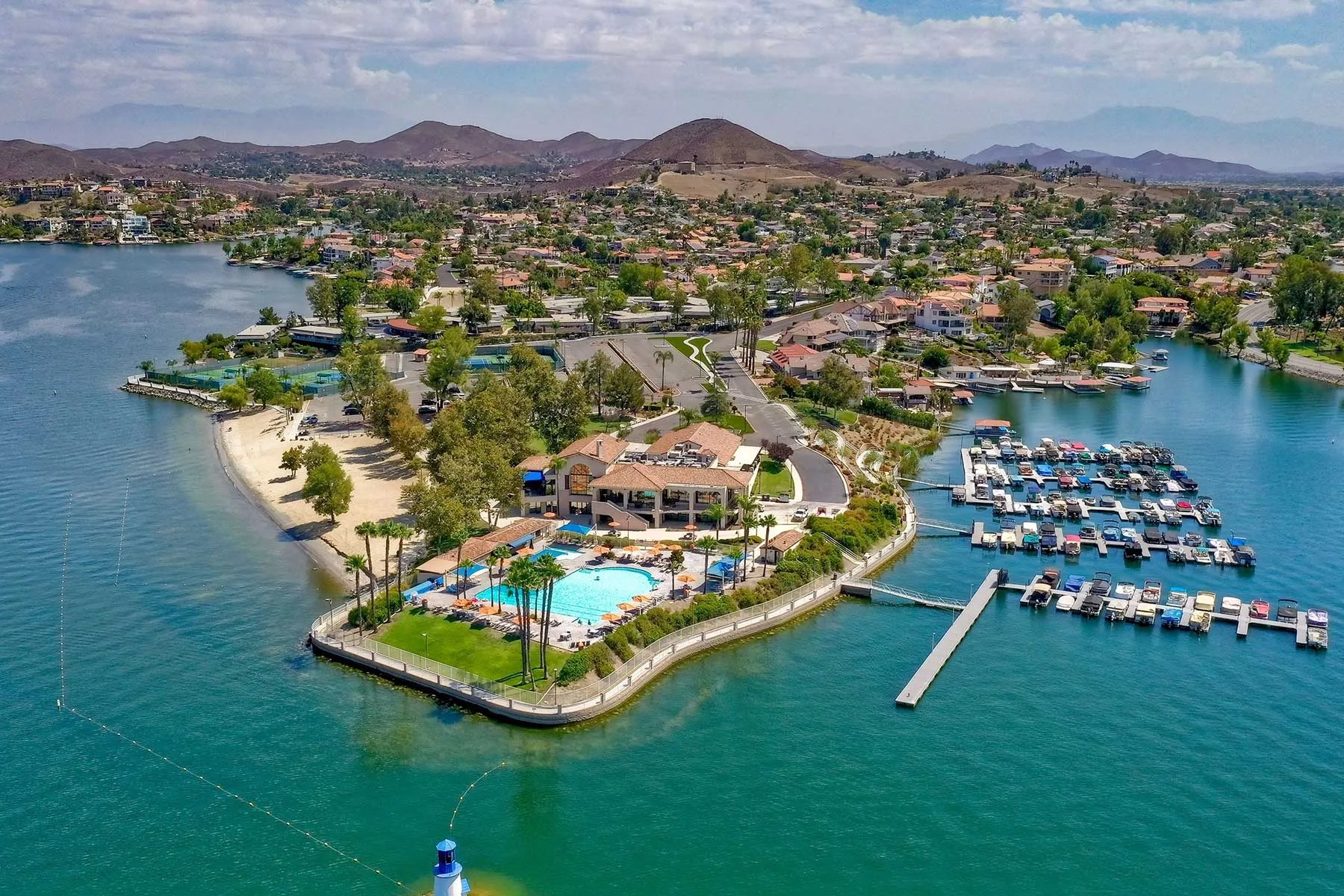 An aerial view of a lakeside residential community near the Quail Valley and Canyon Lake area