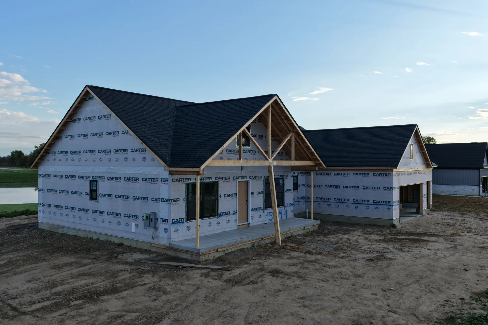 Craftsman-inspired spec home with exposed porch support beams