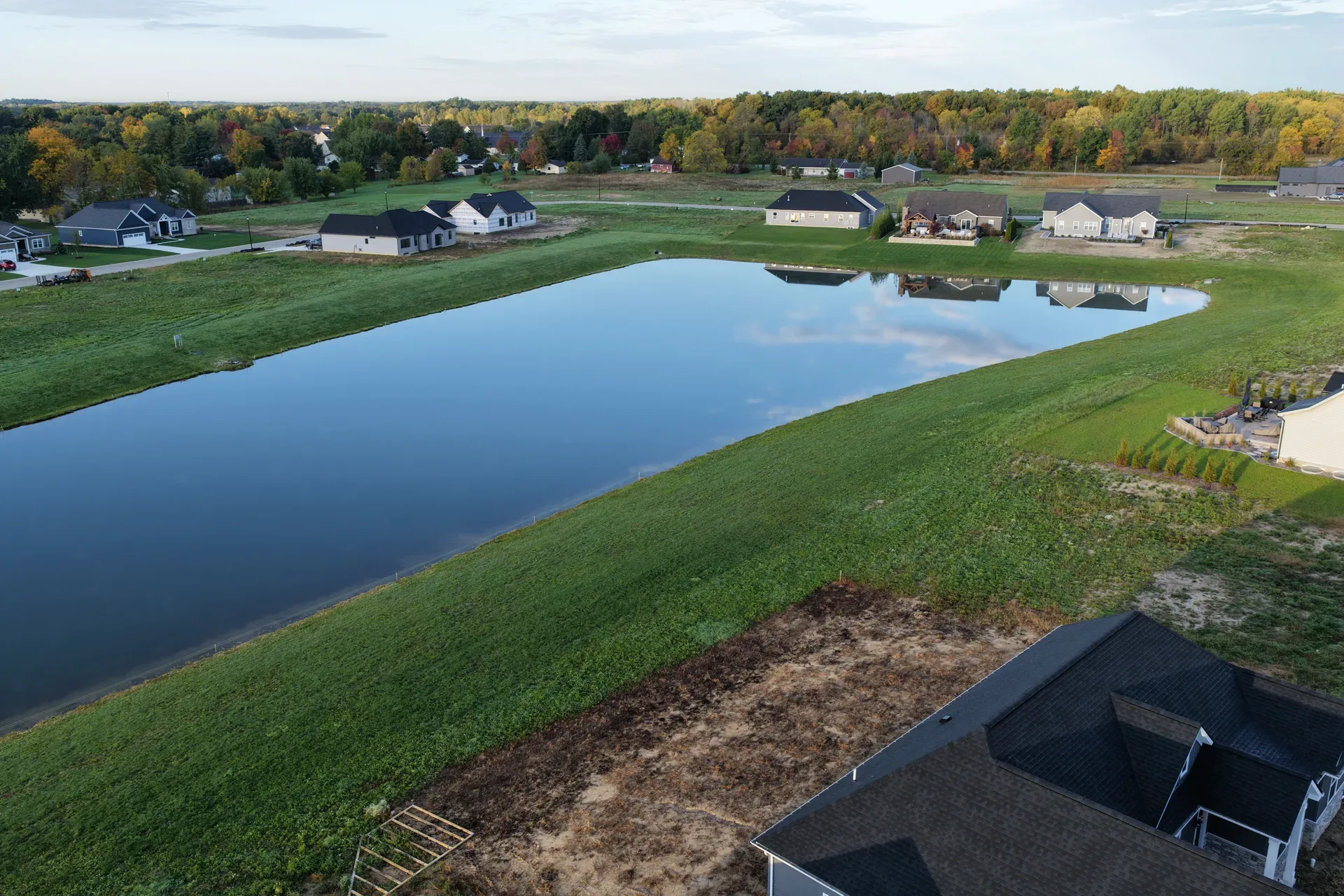 Aerial view of the community centered on its retention pond