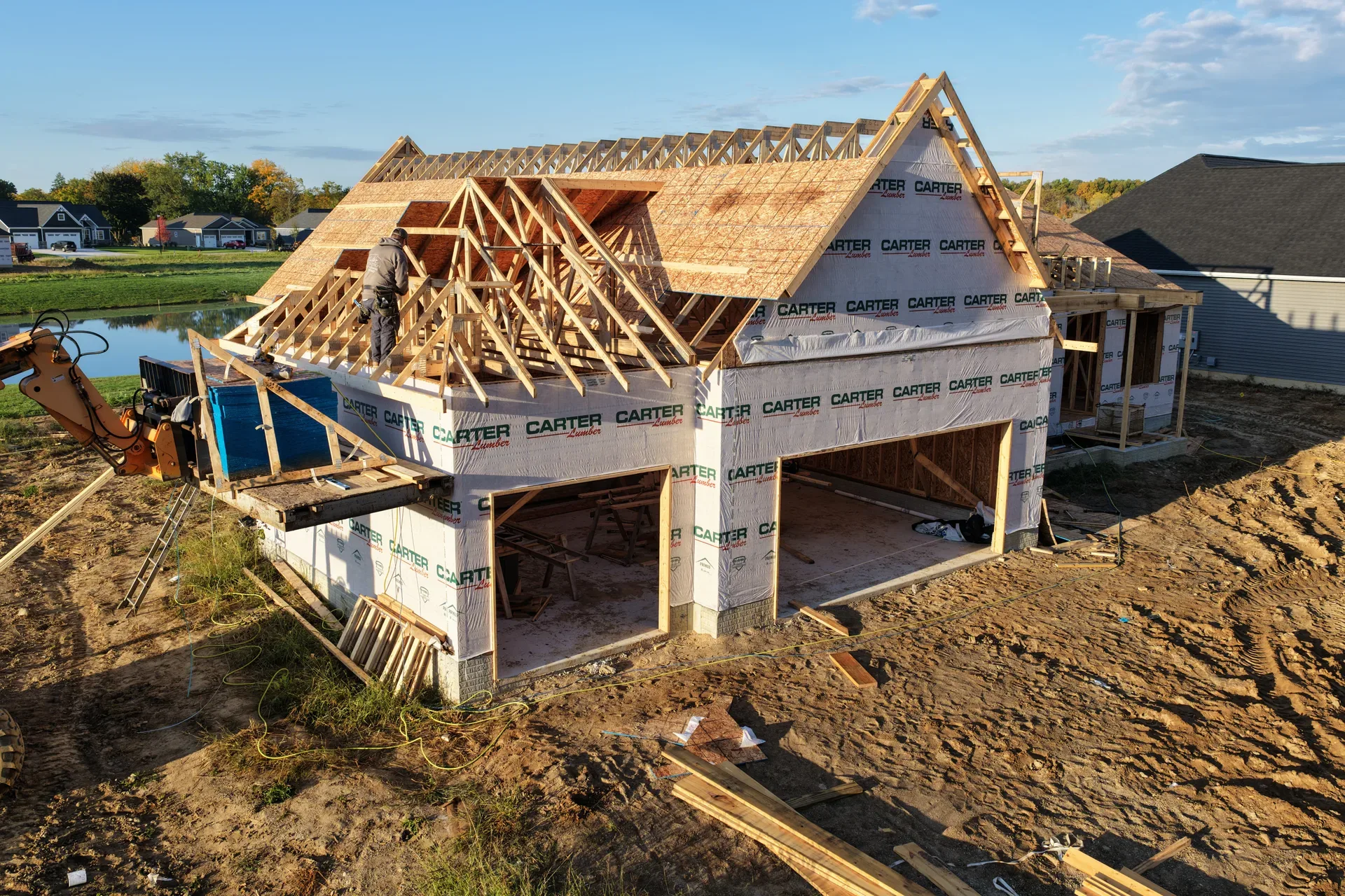 Aerial view of a wood-framed home at golden hour