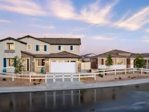 A modern suburban home facade with stucco, stone accents and dark blue shutters at Cimarron Ridge in Menifee