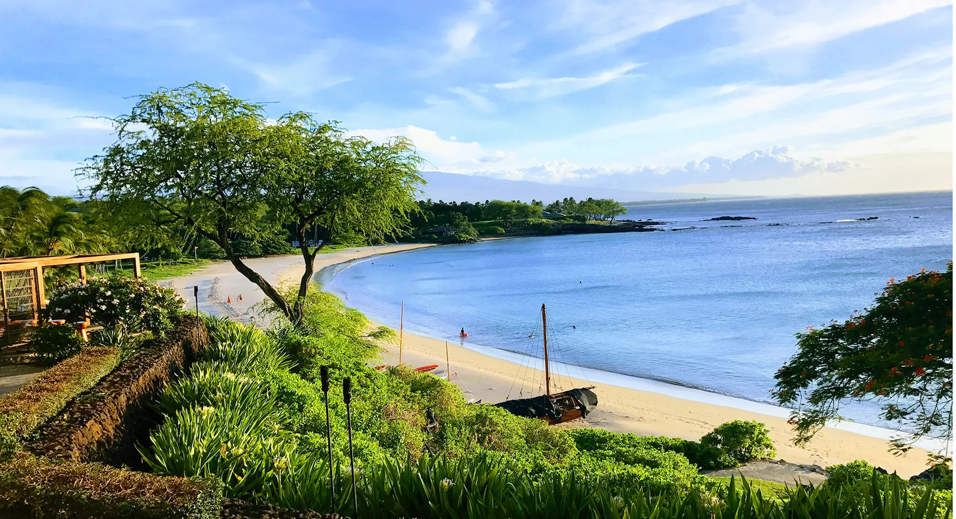 Mauna Kea Beach at the Mauna Kea Resort, a calm crescent bay with green shoreline