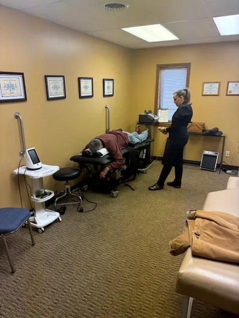 Treatment room with laser therapy unit at Pamer Chiropractic Health Center in Akron, OH