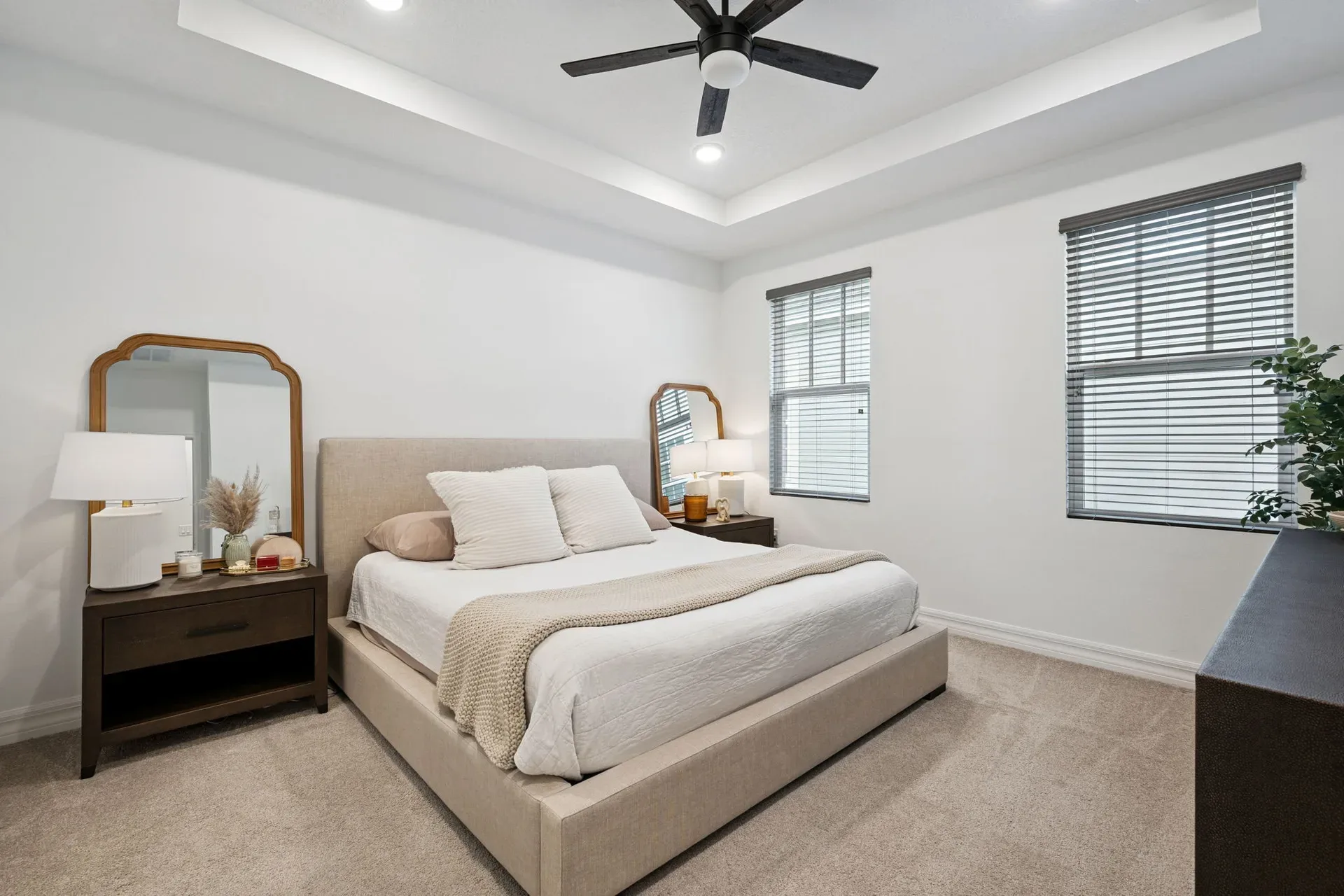 Primary suite with a tray ceiling at 7313 Tidepool Pl in Celebration, Florida
