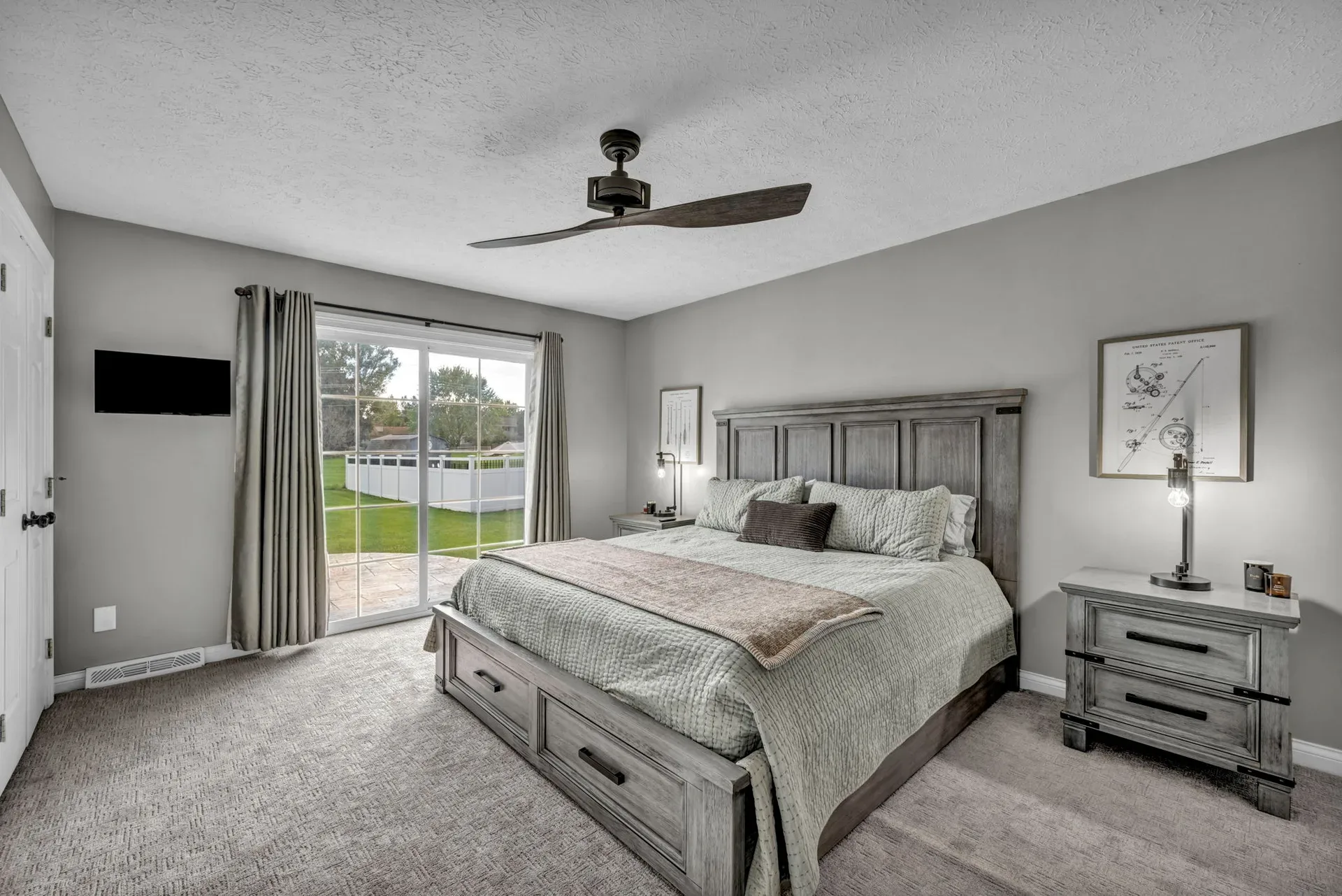 Primary bedroom with a sliding glass door to the backyard