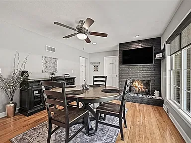 Dining room with a fireplace at 10035 W 55th Street in Merriam