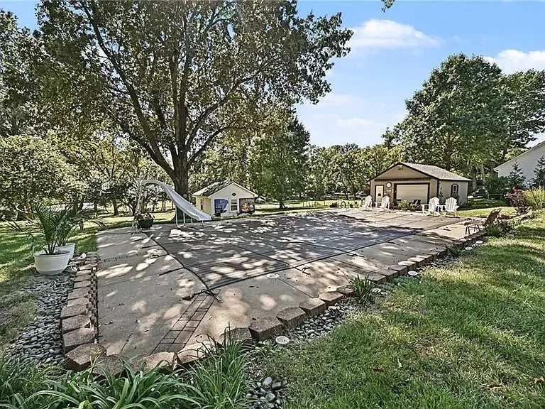 In-ground swimming pool in the backyard of the Merriam home at 10035 W 55th Street