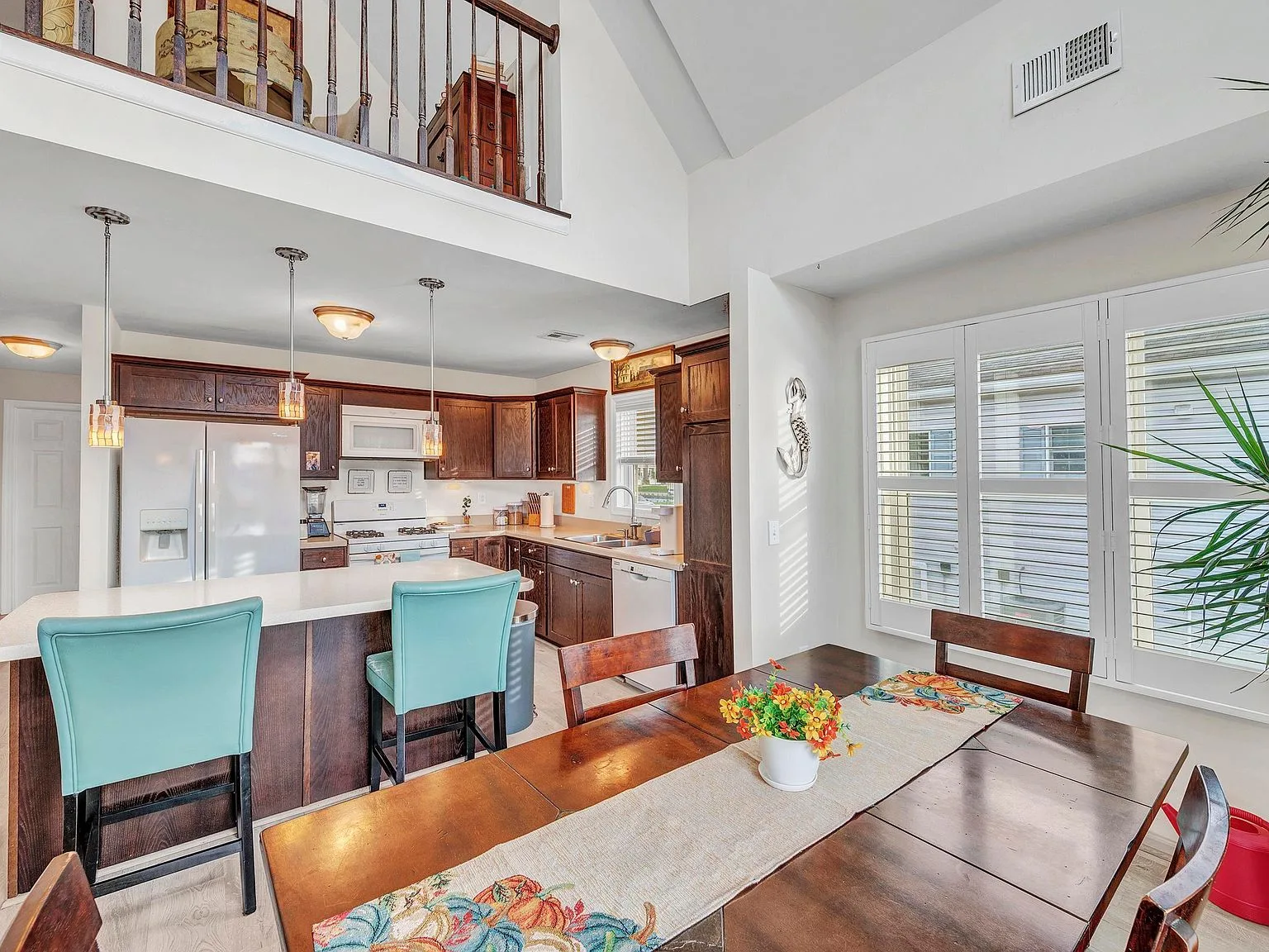Open kitchen and dining area under the loft