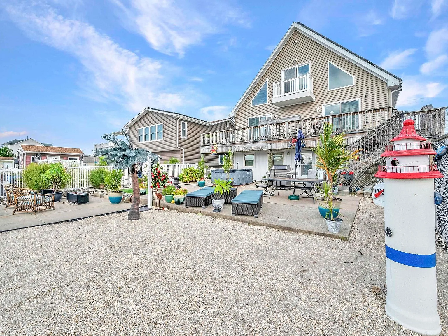 Backyard of the waterfront home with patio and lagoon views