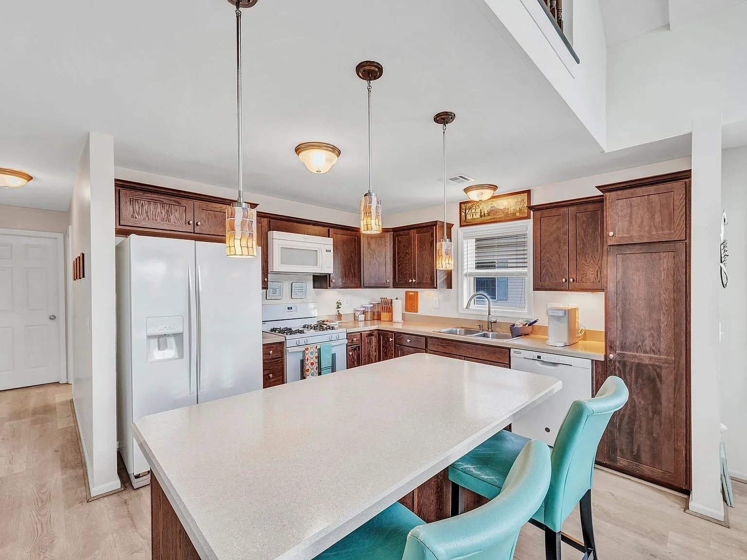 Kitchen island with pendant lights at 1072 Radio Rd